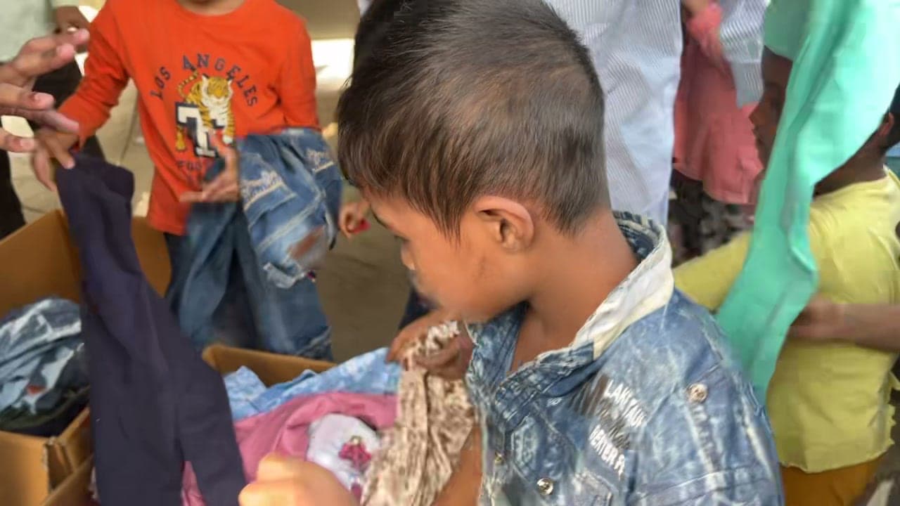 A child selecting clothing at the Korail relief point