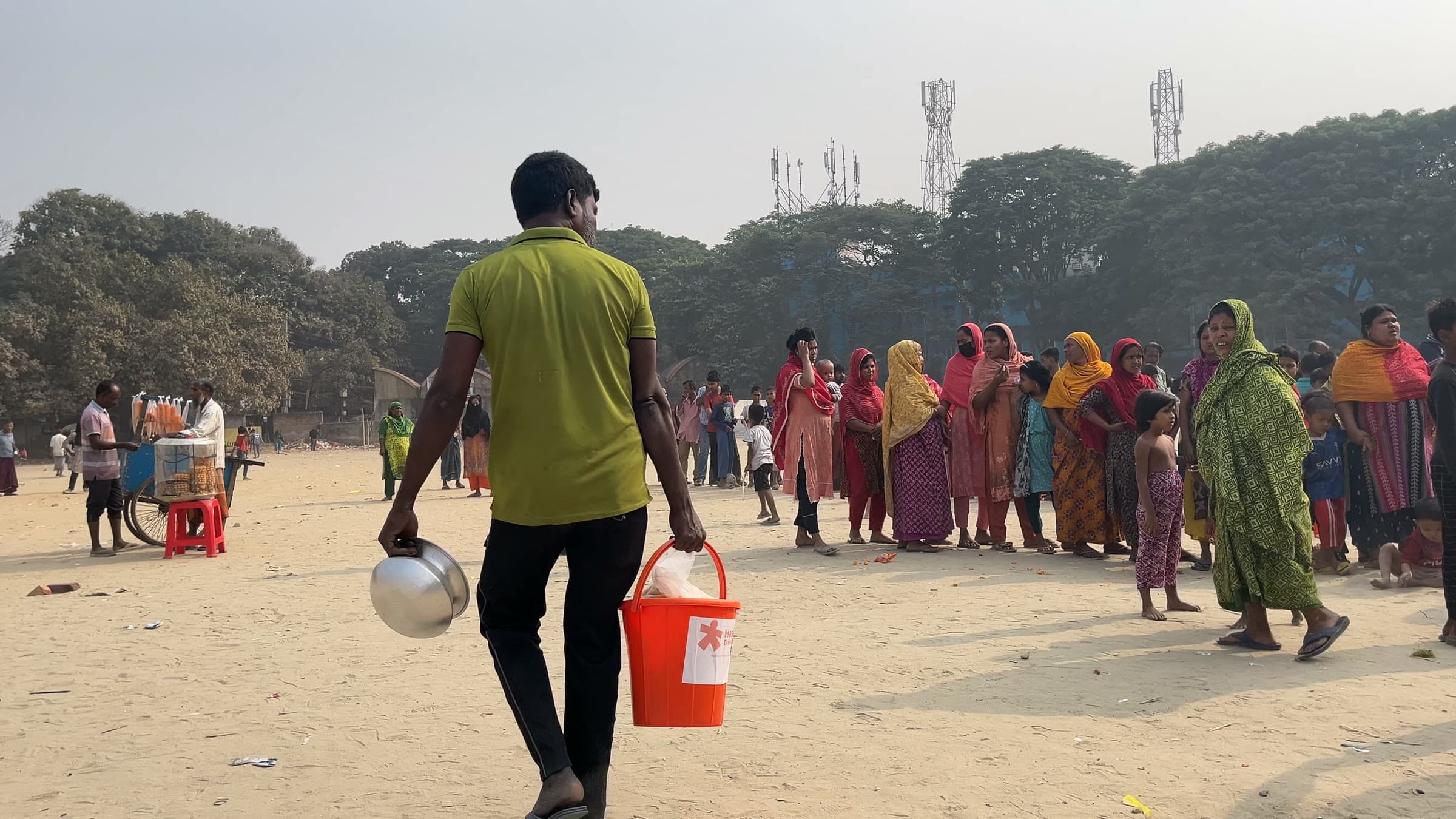 Residents and volunteers during relief distribution in Korail