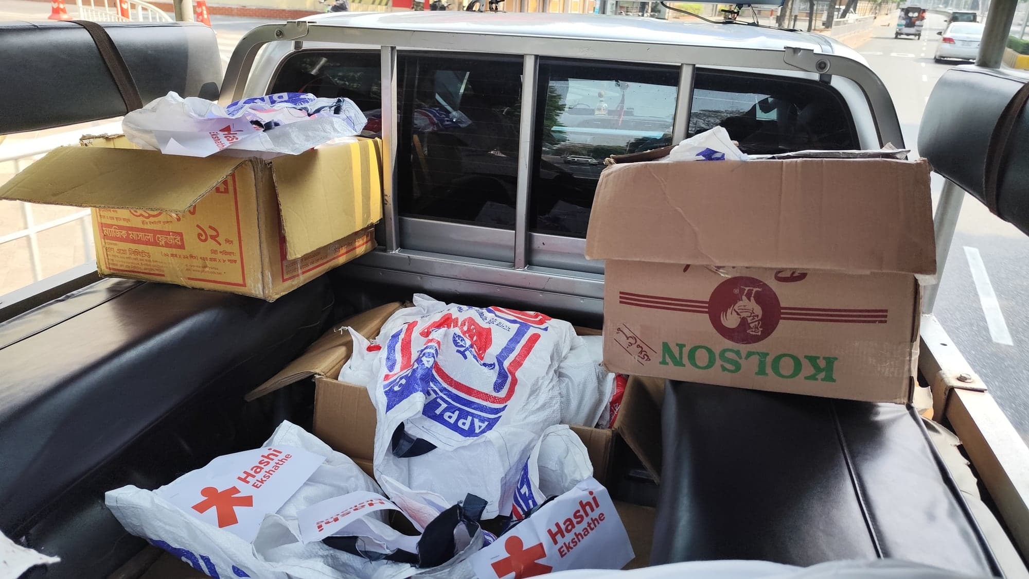 Branded Hashi Ekshathe food packages loaded for delivery in Dhaka