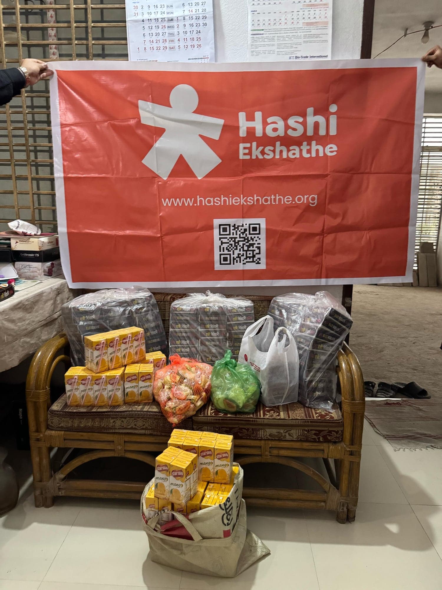 Food and drink supplies prepared beneath the Hashi Ekshathe banner in Rangpur